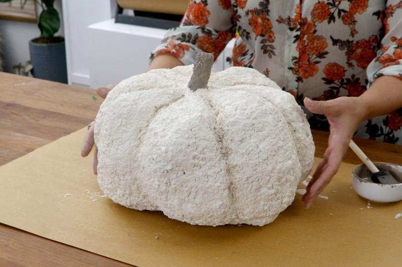 Cream-colored paper mache pumpkin 