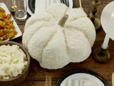 Cream-colored pumpkin on a dinner table 