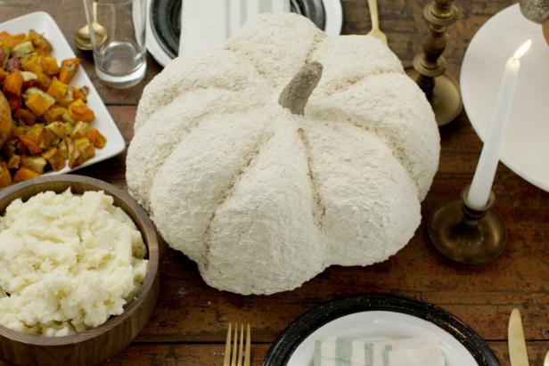 Cream-colored pumpkin on a dinner table 