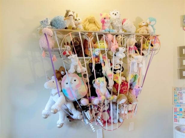 DIY Stuffed Animal Storage Made From Shelves and Elastic