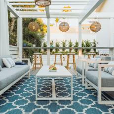 Transitional Covered Patio With Blue Rug