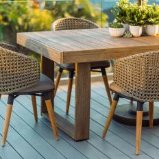 Neutral Outdoor Dining Table and Caned Chairs