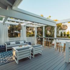 Gray Transitional Deck With Pergola