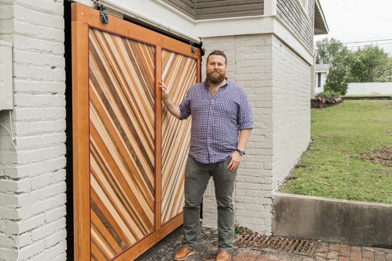 As seen on Home Town, the Ross residence which was renovated by Ben and Erin Napier now features a custom wooden garage door built by Ben.