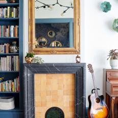 Fireplace With Neutral Tile Surround and Black Marble