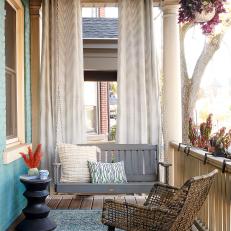 Cheerful Front Porch With Porch Swing