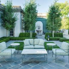 Formal Courtyard With Boxwood Hedges