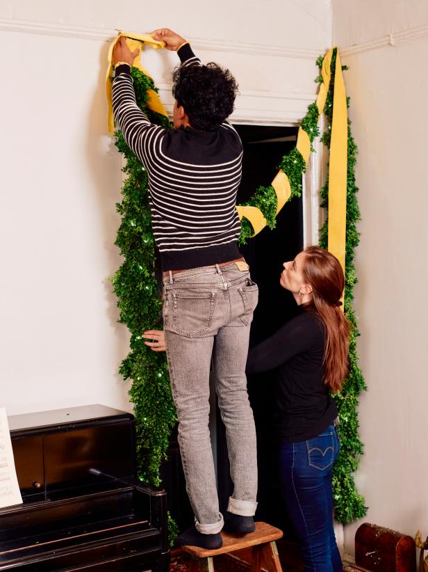 Wrap some colorful ribbon around the green garland and add holiday lights for added interest. Decorate a doorway with the green garland and enjoy throughout the season.