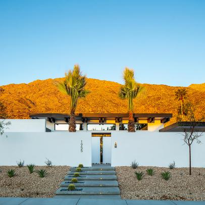 A Contemporary Villa Sits Below Desert Hills and Is Surrounded By Water-Wise Landscaping and Palm Trees