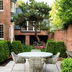 Outdoor Dining Terrace and Brick Wall