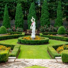 Formal Garden With Female Statue
