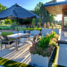 Modern Dining Patio With Steel Planters