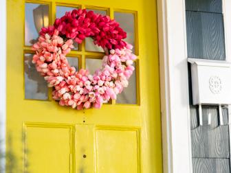 Vibrant Spring Tulip Wreath Hangs on Yellow Front Door