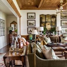 Traditional Farmhouse With Pine Paneled Ceiling and Sporting Themed Artwork 