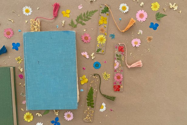 Resin Bookmarks With Dried Flowers Inside Placed In Books on Table