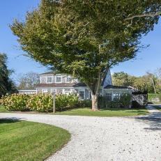 Gravel Driveways In Front of Cape Cod Style Home