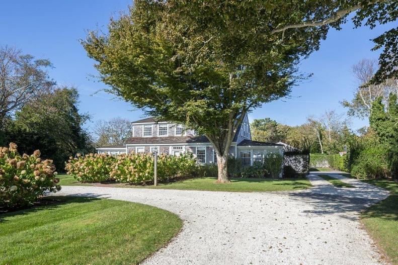 Cape Cod Style Home With Two Gravel Driveways
