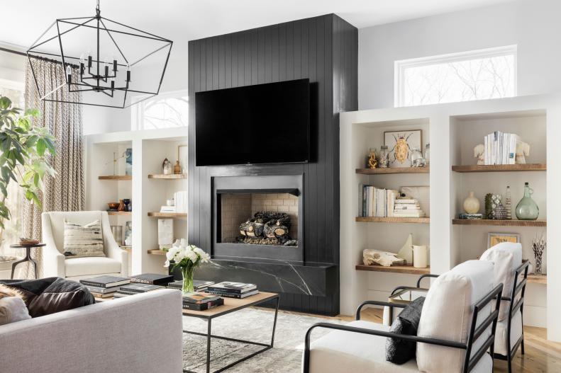 Lauren is masterful with classically neutral and dark and dramatic color palettes. Her spacious, light-soaked living room showcases her prowess for using a timeless black and white color scheme in a fresh, transitional way that puts her expertise of interior architecture on full display. 