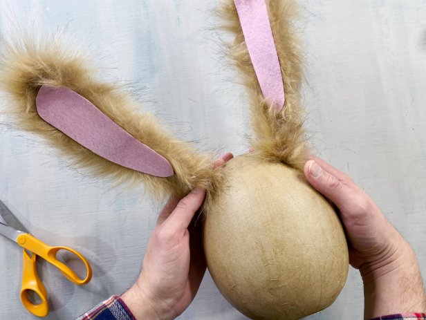 Brown bunny ears glued to egg