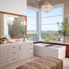 Neutral Primary Bathroom With Upholstered Bench