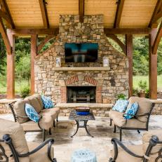 Covered Patio With Large Stone Fireplace
