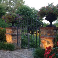 Iron Gate With Landscape Lighting