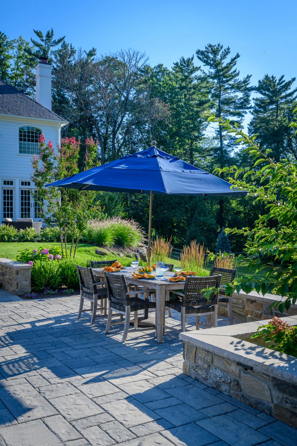 Outdoor Dining Table With Blue Umbrella | HGTV