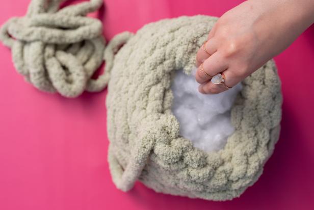 Fill the inside of pillow with polyester fiber fill, and fill it up as much as desired. Tip: Spread the fiber fill evenly inside the pillow to minimize lumps.