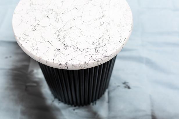 Once the base is dry, use wood glue to attach the marble-like top to the base matte black base. Tip: To secure, place heavy books on top to help create a stronger bond.