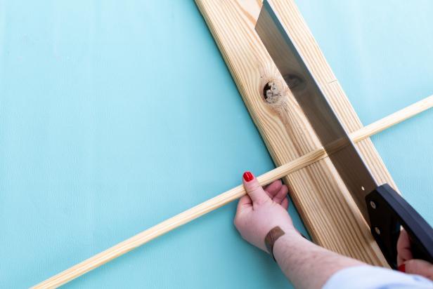 To get a fluted look, use a hand saw to cut 60 11/16 half-round trim pieces to the same length as the tube.