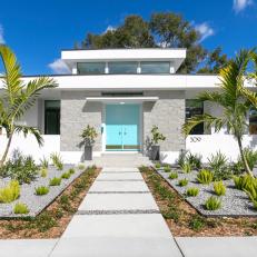 Midcentury Modern Exterior With Blue Front Doors