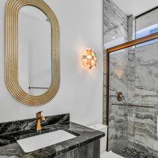 Gray Art Deco Bathroom With Gold Mirror