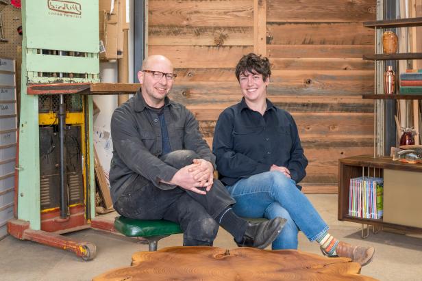 Man and Woman Sitting in Woodworking Studio, Posed for Camera
