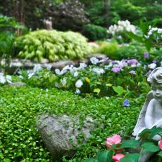 Garden With Cupid Statue