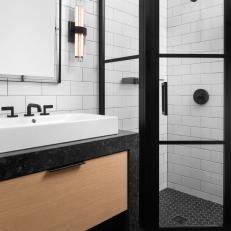 Black and White Bathroom With Corner Shower