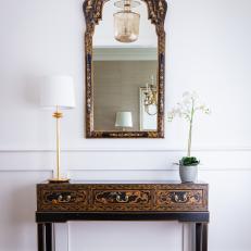 Foyer With Black Chinoiserie Table and Mirror