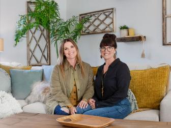 Leslie Davis, left, and her twin sister Lyndsay Lamb, right, pose in den of a house they remodeled in Snohomish, Washington as seen on Unsellable Houses (After)