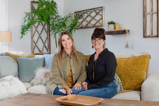 Leslie Davis, left, and her twin sister Lyndsay Lamb, right, pose in den of a house they remodeled in Snohomish, Washington as seen on Unsellable Houses (After)