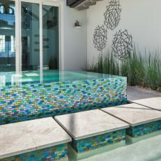 Pool With Multicolored Tile Surround