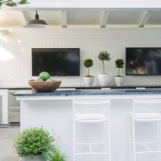 White Outdoor Kitchen With Container Gardens