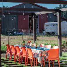 Outdoor Dining Room With Orange Chairs