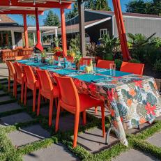 Outdoor Dining Area With Orange Chairs