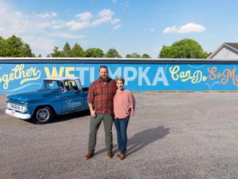 As seen on Home Town Takeover, Ben and Erin Napier pose with the Scotsman Chevrolet in front of the Wetumpka signage in downtown Wetumpka, Alabama.