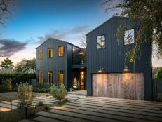 This modern farmhouse features a pine garage door.