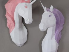 White unicorns, one with pink mane and one with purple mane on wall