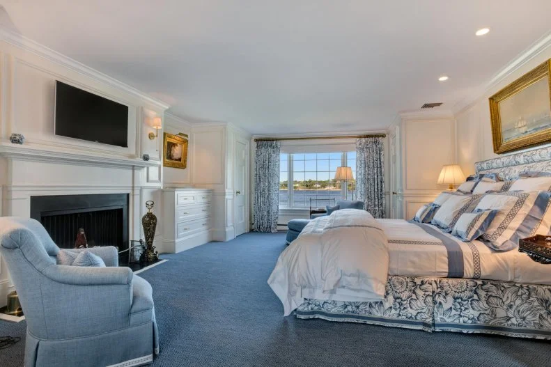 Blue-and-White Bedroom With Inset Fireplace