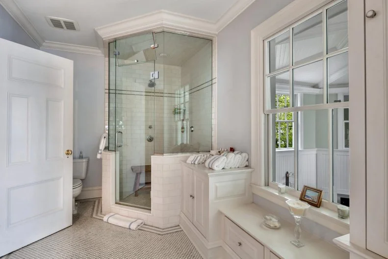 Mosaic Tile Floor Joins Subway Tile Shower in Traditional Bathroom