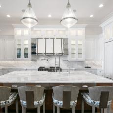 Stunning Gourmet Kitchen with Custom White Cabinetry Dazzles in White Marble 
