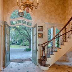 Traditional Foyer With Curved Staircase