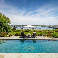 Harborside Terraced Pool With Chaise Lounges and Pergola